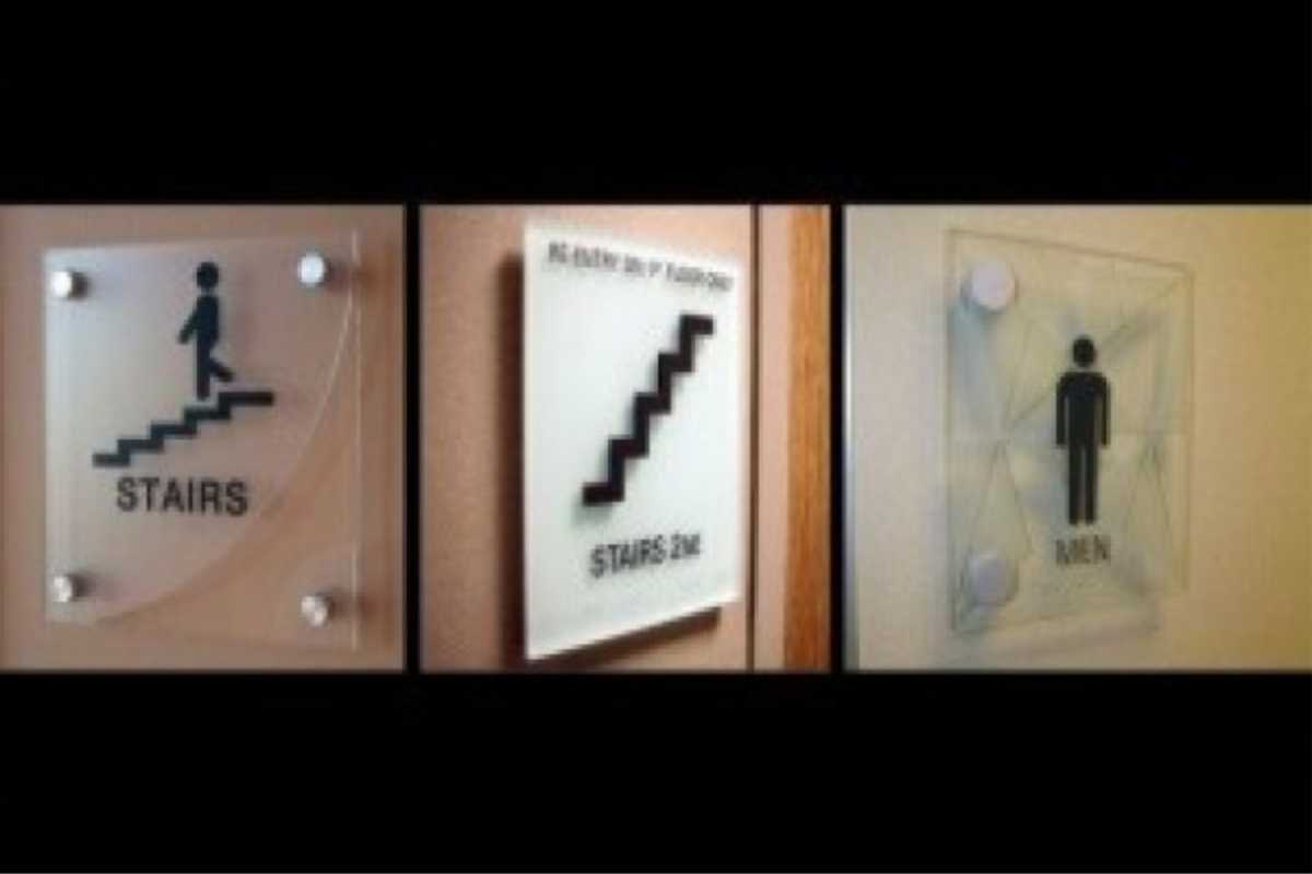 stairs and restroom signs