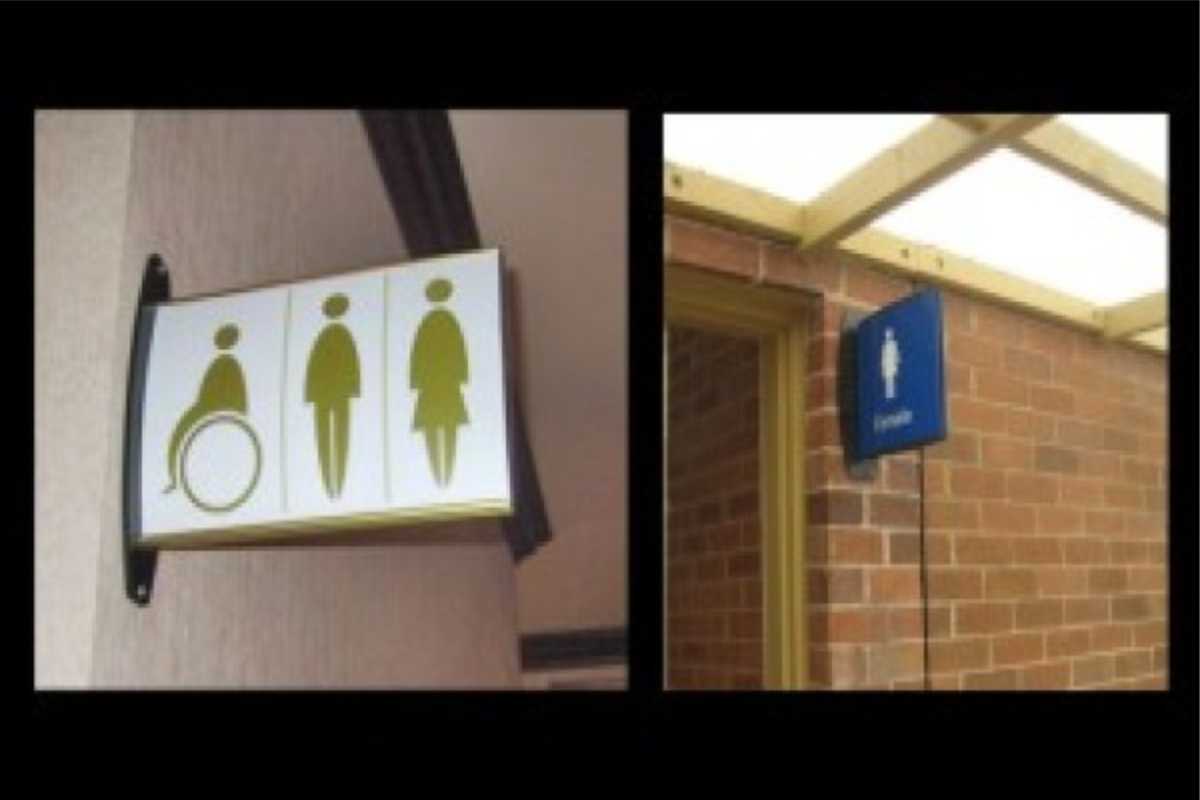 various signs for restrooms