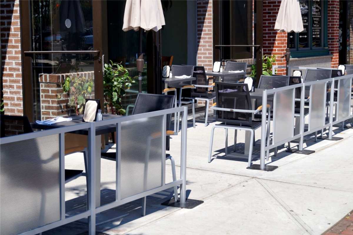 sidewalk barriers defining outdoor eating area